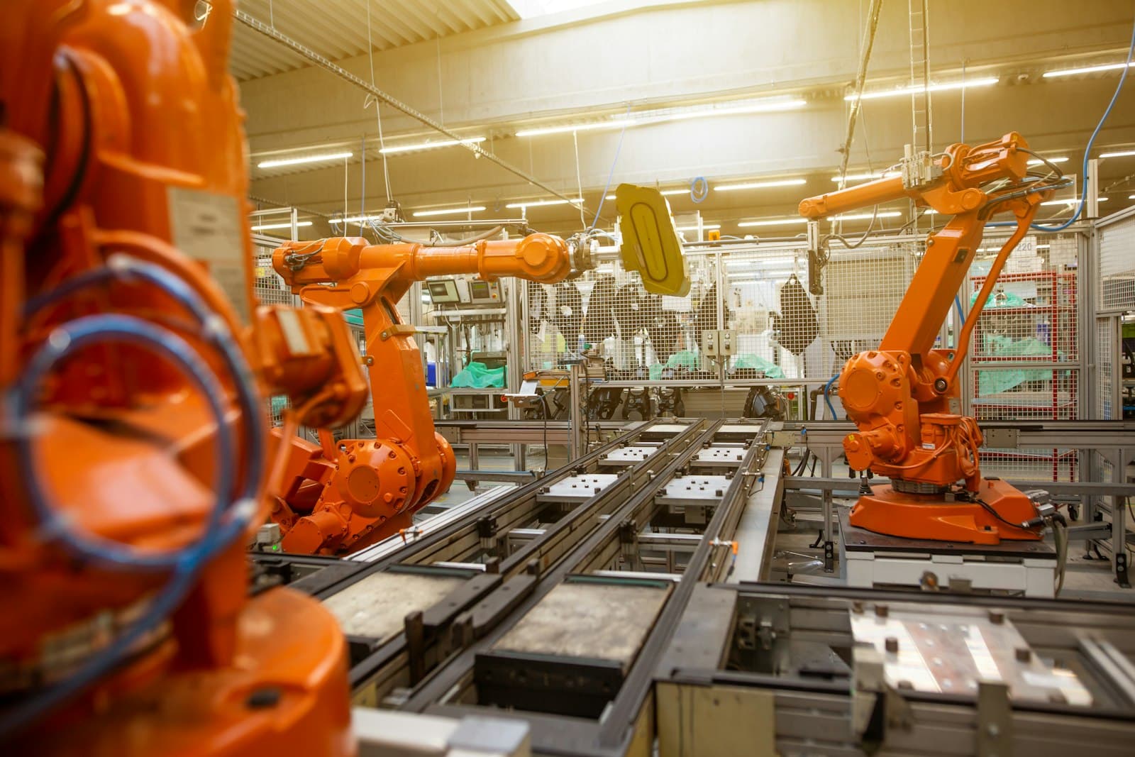 Industrial robotic arms on a factory production line
