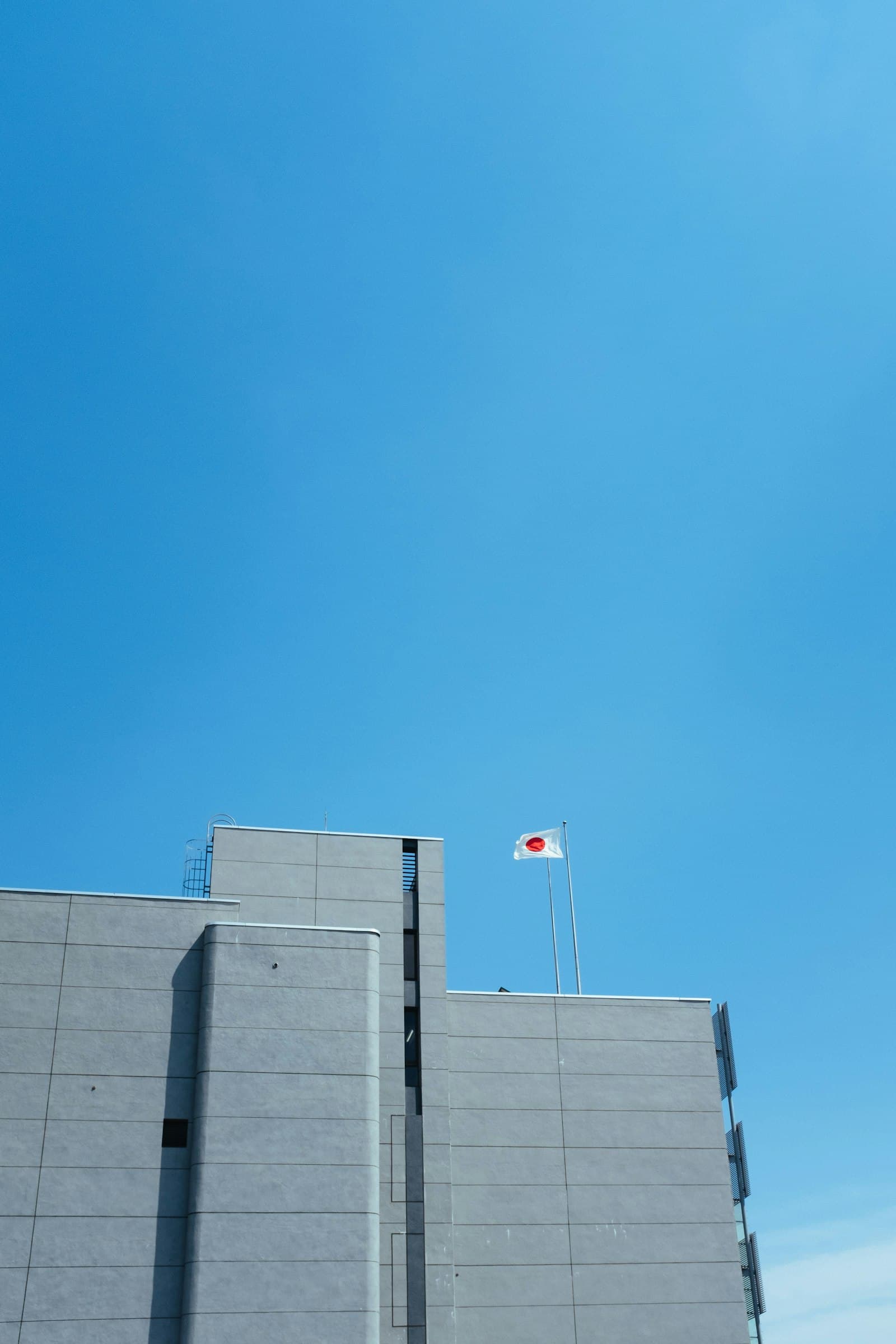 Japanese flag flying atop an office building